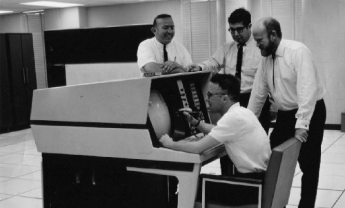 University of Colorado, fascinated by a CDC6400 (Prof Waite seated, Prof Poole on right)